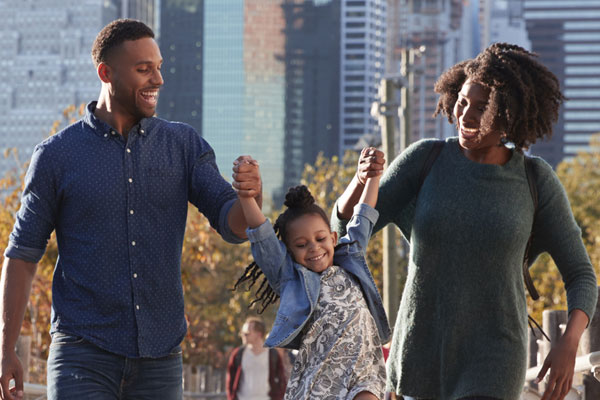 A family walking in an urban park