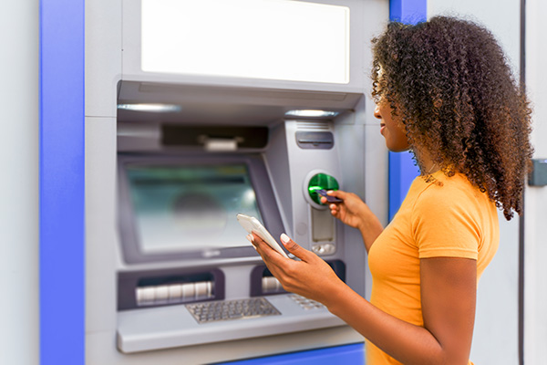 A woman using an ATM