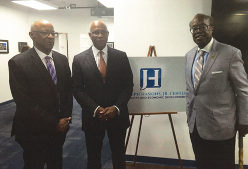 Three men posing at the Joseph Haskins, Jr. Center